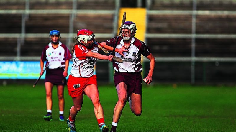 Slaughtneil&rsquo;s Eilis Cassidy tries to escape the attentions of Loughgiel&rsquo;s Aine Connolly during yesterday&rsquo;s Ulster Senior Camogie Championship final at the Athletic Grounds. Picture by Seamus Loughran