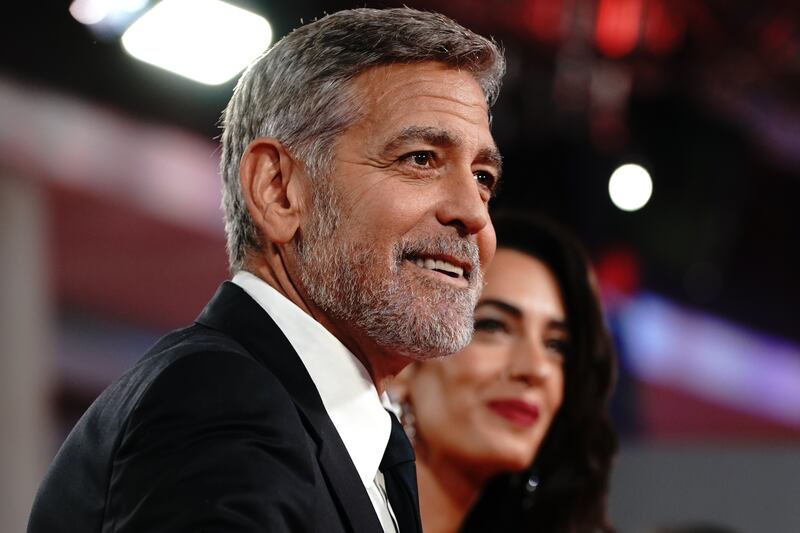 George Clooney plays photographer at star-studded charity event