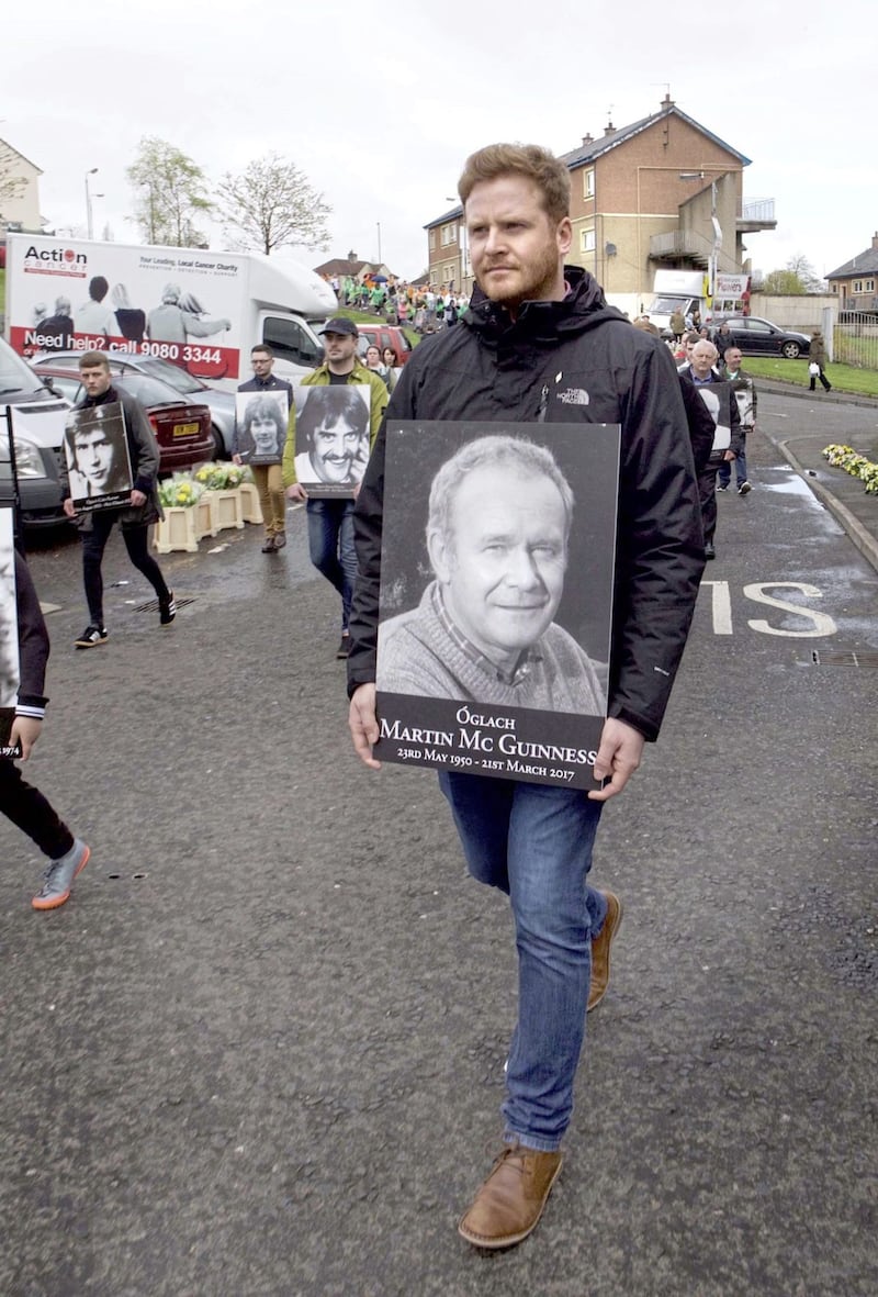 Emmett McGuinness carrying a portrait of his father Martin on the way to the annual Republican Easter Rising commemoration in Derry city cemetery on Easter Sunday. Picture by Margaret McLaughlin 