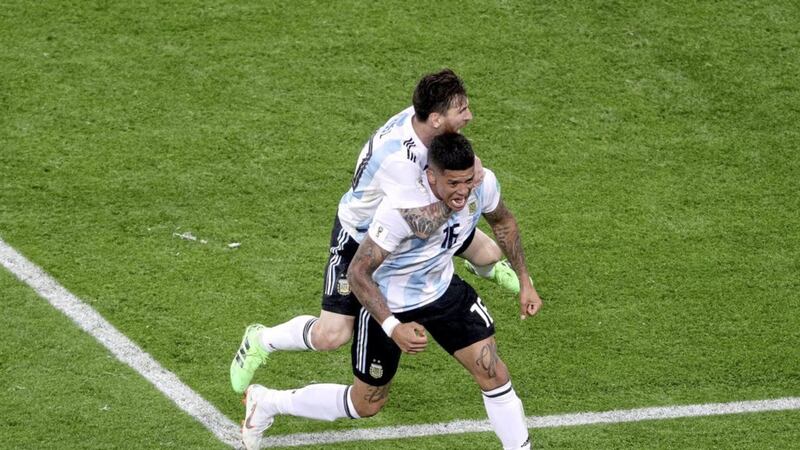 Argentina&#39;s Marcos Rojo (front) celebrates scoring his side&#39;s second goal of the game against Nigeria with team-mate Lionel Messi 