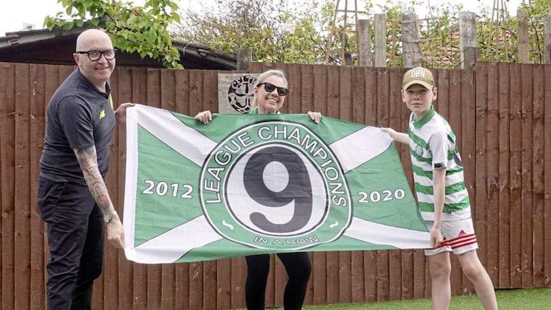 Tony Hamilton, chief executive of the Celtic FC Foundation, celebrates the second nine in-a-row with his wife Lynne and youngest son Joe.
