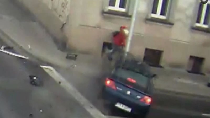 The car hit the lamp post as the woman in the video can be seen ducking for cover&nbsp;