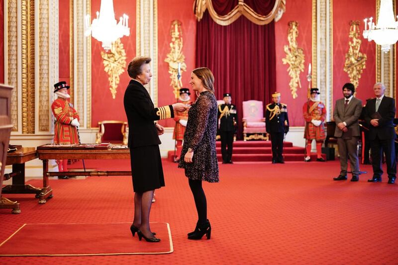Hannah Mills being made an Officer of the Order of the British Empire by the Princess Royal 