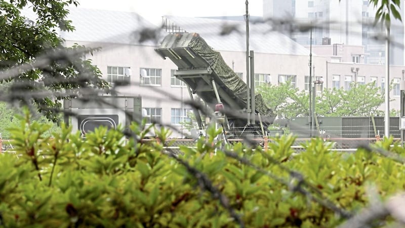 A PAC-3 Patriot missile unit is seen deployed in the compound of the defence ministry in Tokyo yesterday. North Korea is formulating a detailed plan to launch a volley of ballistic missiles toward the US Pacific territory of Guam, a major military hub and home to US bombers PICTURE: Shizuo Kambayashi/AP 