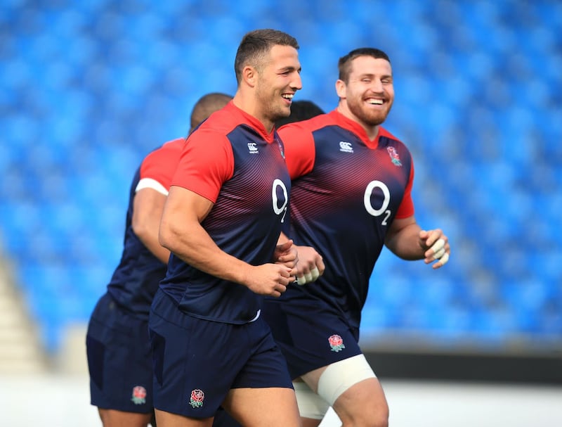 Sam Burgess, left, smiles during an England training session in 2015