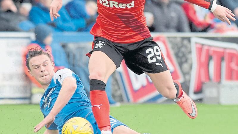 Rangers&rsquo; Michael O&rsquo;Halloran skips away from Queen of the South&rsquo;s Jordan Marshall during Sunday&rsquo;s Ladbrokes Championship clash at Palmerston <span class="Apple-tab-span" style="white-space: pre;">		</span>