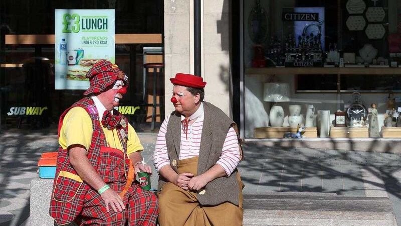 Two clowns speak at the first International Clown Festival in Downpatrick, Co Down