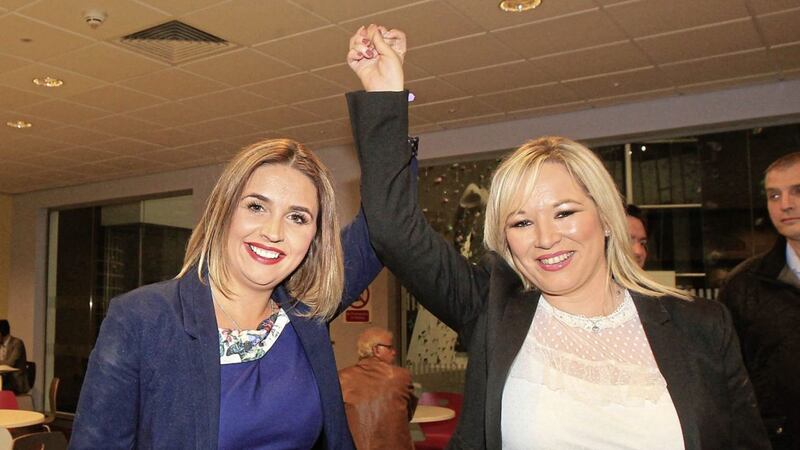 According to those who saw the video, Elisha Mc Callion, left, allegedly encouraged residents in the area to answer their doors, adding they should not worry as she was not the &quot;debt collector&quot;. Mrs McCallion is pictured with her party&#39;s northern leader Michelle O&#39;Neill after her election as MP 