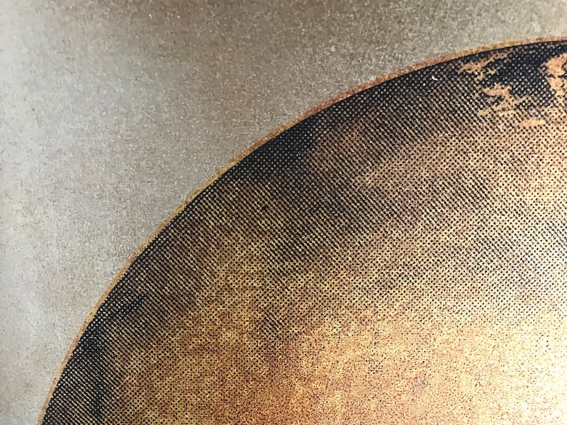 A close up of his Mars piece