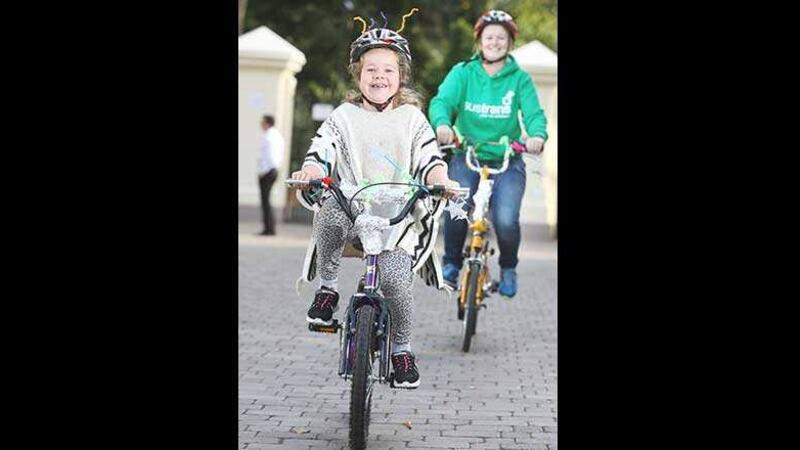 Evvie Bishop (8) from Belfast 'blings up' her bike as she gets ready for the first Ciclovia Belfast