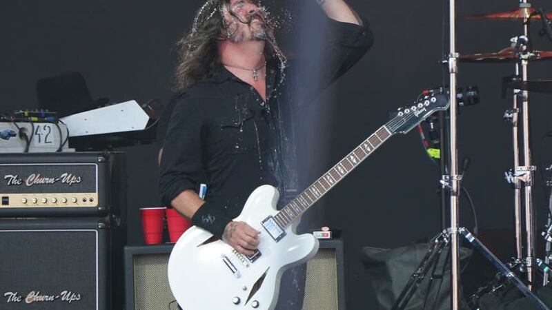 Dave Grohl of Foo Fighters, performing under the name The Churnups, on the Pyramid Stage (PA)