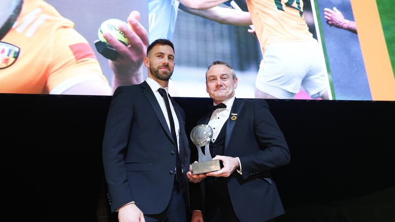 Neil Manus receives his Irish News Ulster Allstars Hurling Player of the Year award from Ulster GAA President Ciaran McLaughlin
