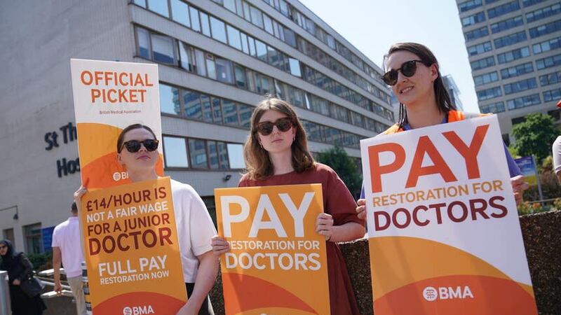 Striking junior doctors from the British Medical Association stand on the picket line outside St Thomas’ Hospital in London (Lucy North/PA)