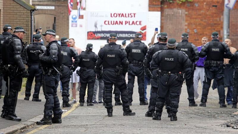 Large numbers of police move into Cluan Place in east Belfast to remove a loyalist bonfire. 