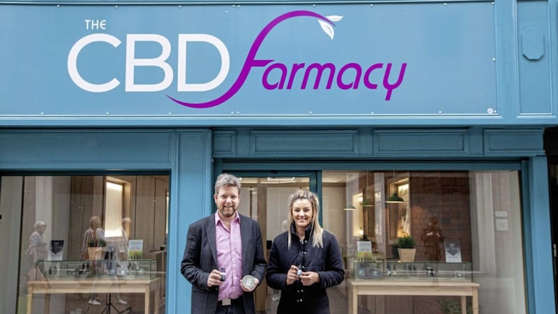 The CBD Farmacy owner, Brian Geraghty pictured outside the new Belfast store alongside local MMA fighter, Leah McCourt 