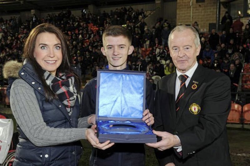 Fifteen-year-old Sean Kelly, a member of the St Gall&rsquo;s club in Belfast, is the overall winner of the Translink Ulster GAA Young Volunteer of the Year award. The awards programme, in its first year, was designed to celebrate the important contribution young GAA volunteers make to their own communities. Clubs across Ulster were invited to nominate young people throughout the year, and each month a panel of experts chose someone for the monthly prize. Sean, who won in June, was subsequently selected as the overall winner. His prize package includes a full set of playing jerseys for his club, as well as a commemorative jacket and trophy for himself. Presenting Sean with the award at half-time during last weekend&rsquo;s Bank of Ireland Dr McKenna Cup final are Ulster Council president Michael Hasson and Translink&rsquo;s Ursula Henderson 