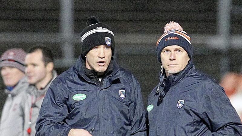 Jim McCorry (right), pictured with Armagh boss Kieran McGeeney, says moving the Sigerson Cup to after the Ryan Cup would end conflict between county and university managers 