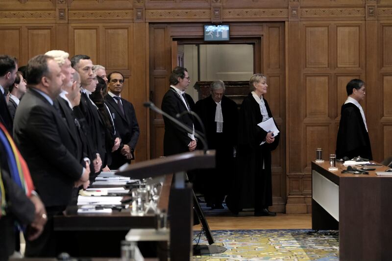 Judges enter the room during the opening of the hearings at the International Court of Justice (Patrick Post/AP)