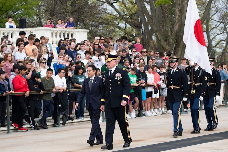 Fumio Kishida is accompanied by Commanding General Military District of Washington Major General Trevor Bredenkamp, right, during a wreath laying ceremony at the Tomb of the Unknown Soldier, at Arlington National Cemetery, in Arlington, Virginia (Manuel Balce Ceneta/AP)