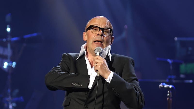 Footage shared online showed the comedian, dressed in his famous black suit and large-lapelled shirt, jumping around the stage.