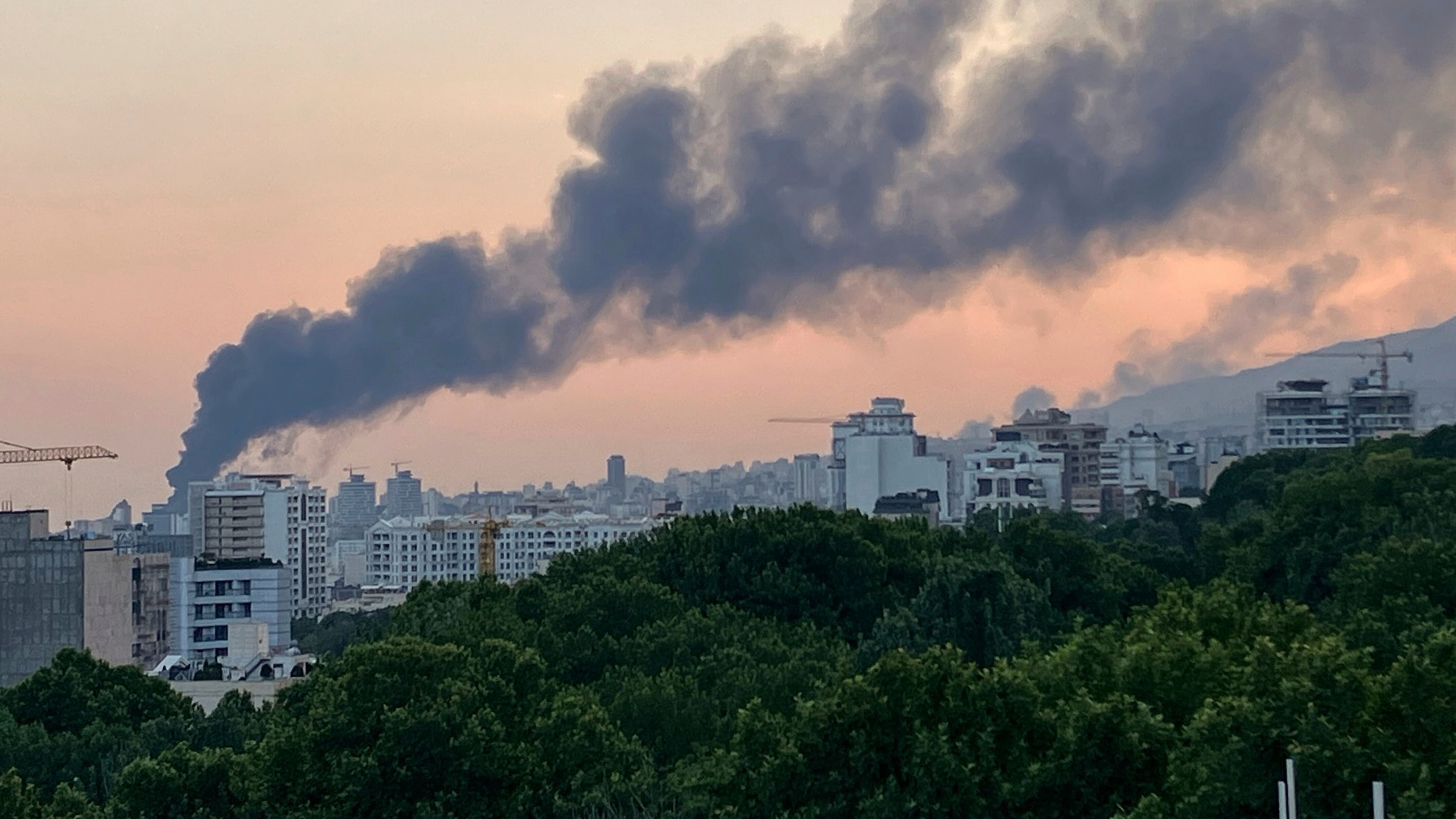 Smoke rises from the building of Iran’s state-run television after an Israeli strike in Tehran, Iran (AP)