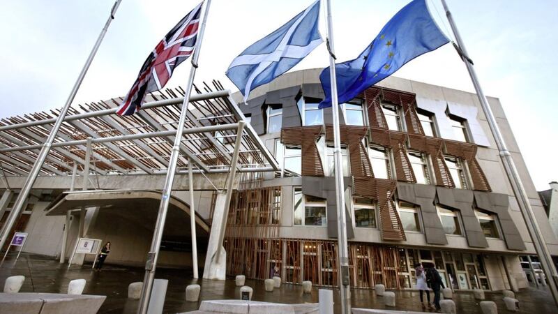 A Union flag, a Saltire and the European Union flag outside the Scottish Parliament in Edinburgh. Picture by Andrew Milligan, Press Association 