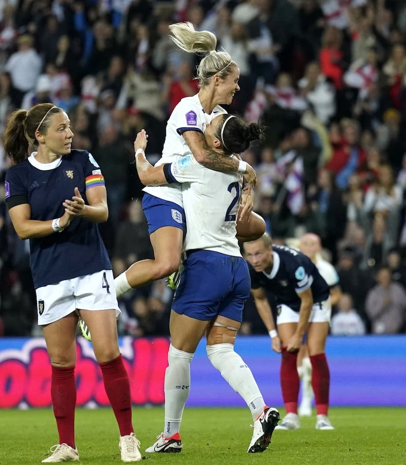Lucy Bronze, right, celebrates her goal with Rachel Daly