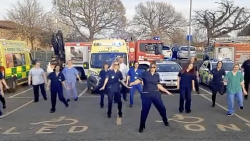 Healthcare staff performing choreographed routines during lockdown 