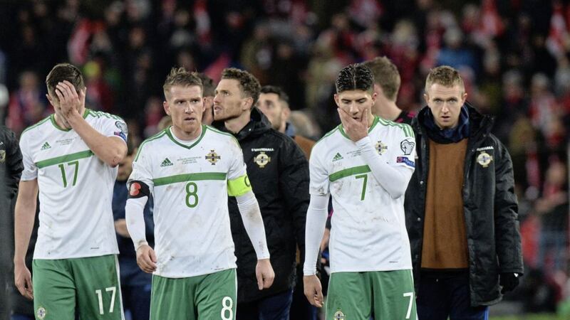 Oliver Norwood, Steven Davis and Jordan Jones are dejected after Northern Ireland failed to turn around a one-goal deficit in Basel Picture by Colm Lenaghan/Pacemaker Press 