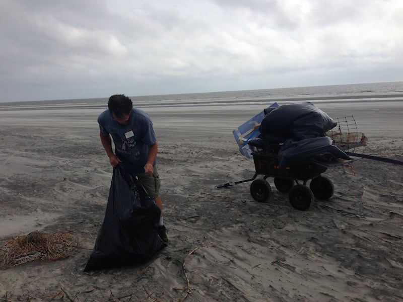 David Humphries litter picking on the beach