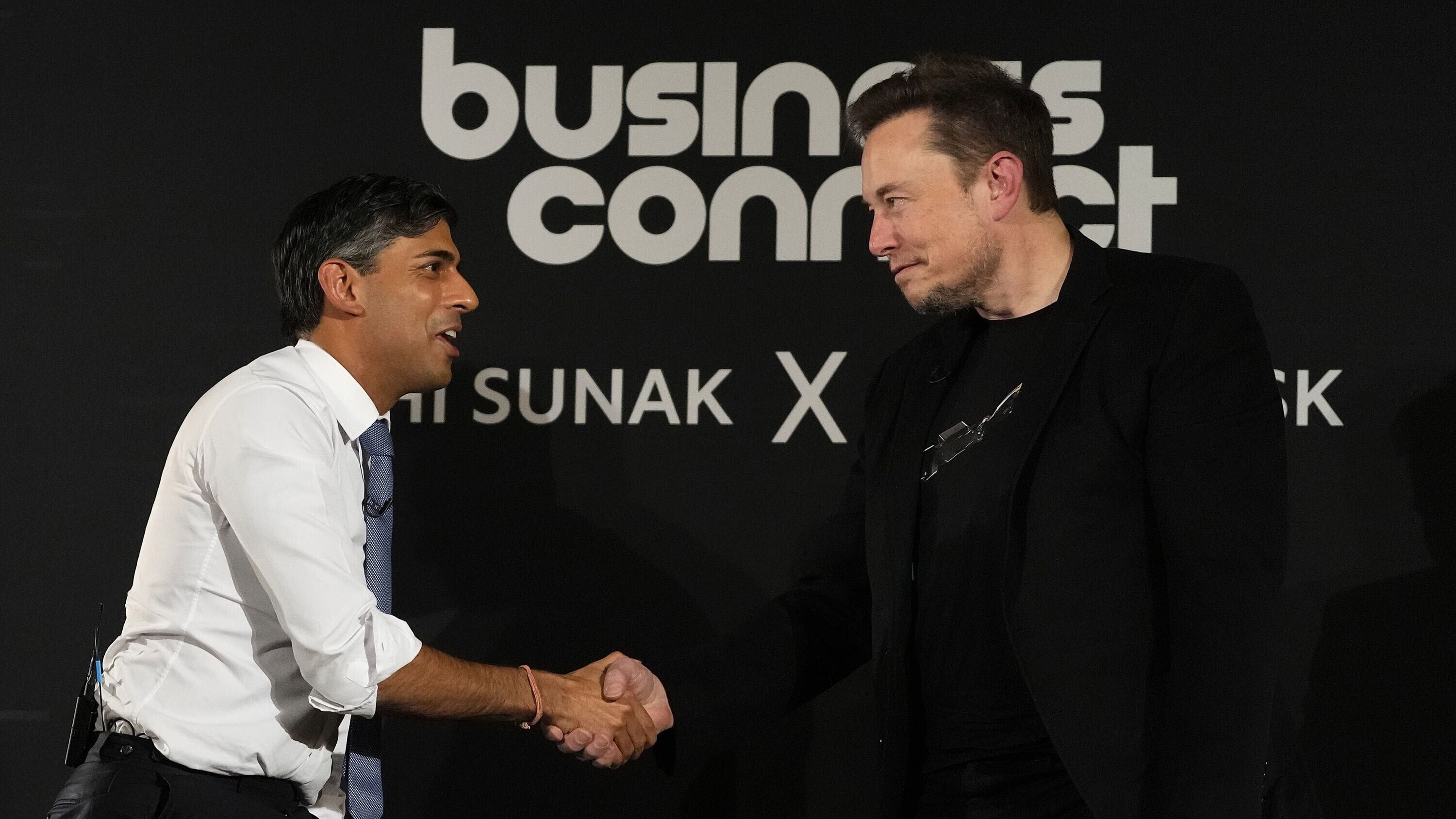 Rishi Sunak shakes hands with Elon Musk (Kirsty Wigglesworth/PA)