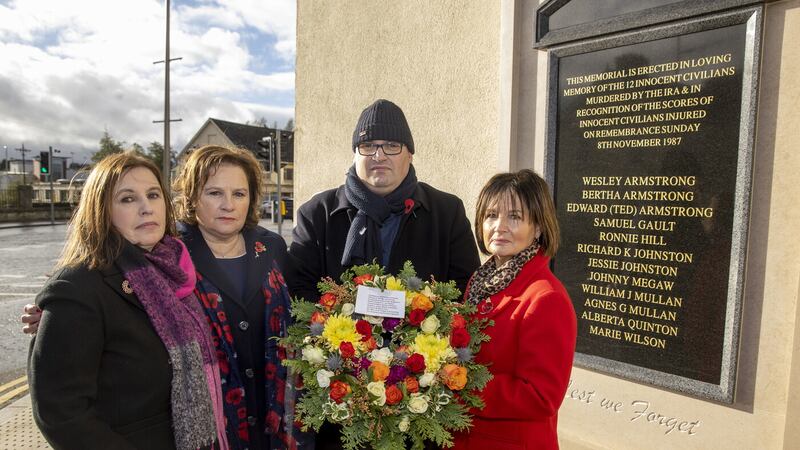 The children of Wesley and Bertha Armstrong, (left to right) Moyna Nesbitt, Stella Robinson, Julian Armstrong and Pamela Whitley, take part in an act of remembrance to mark the 35th anniversary of the Enniskillen bomb, at the newly installed memorial. Picture by Liam McBurney/PA Wire