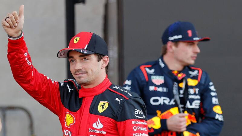 Ferrari driver Charles Leclerc gives a thumbs up as Red Bull driver Max Verstappen of the Netherlands, stands behind him (Andres Staph/Pool photo via AP)