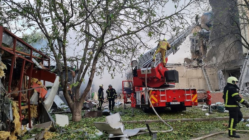 Russian missiles and artillery pounded cities across Ukraine early on Thursday, sparking fires, killing at least three people and trapping others under the rubble of destroyed buildings, authorities said (Ukrainian Emergency Service/AP)