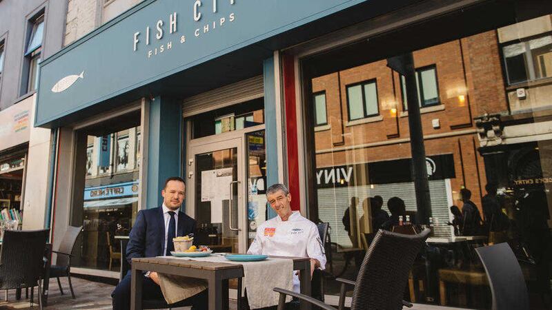 Pictured outside the new restaurant on Ann Street are Gareth Howell (left) from Osborne King and John Lavery from Fish City 