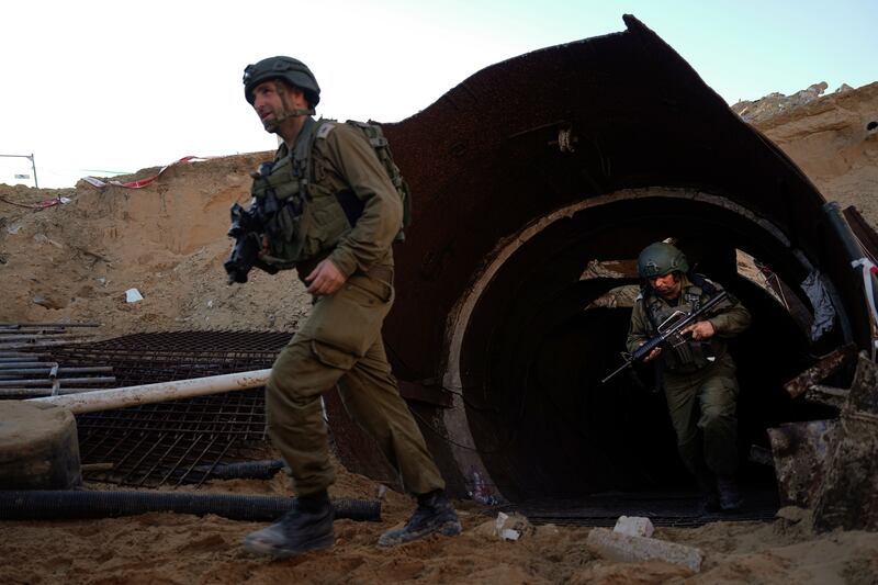 Israeli soldiers exit a tunnel that the military says Hamas militants used to attack the Erez crossing (Ariel Schalit/AP)