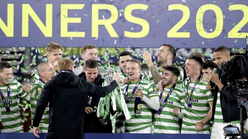 Celtic manager Neil Lennon celebrates with the players after his side defeated Hearts to lift the Scottish Cup at Hampden Park, Glasgow on Sunday December 20, 2020. Picture by Andrew Milligan/PA Wire. 