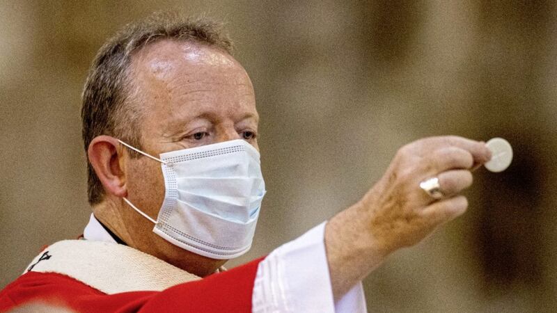 Archbishop of Armagh Eamon Martin wears a face mask during holy communion at St Patrick&#39;s Catholic Cathedral in Armagh. Picture by Liam McBurney/PA Wire 