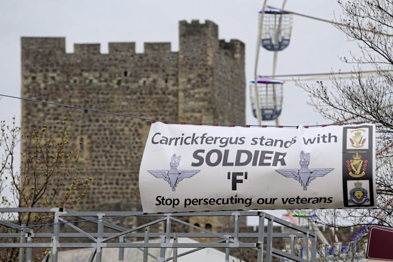 Banners supporting 'Soldier F', along with Parachute Regiment flags, on display close to Carrickfergus Castle. Picture by Cliff Donaldson