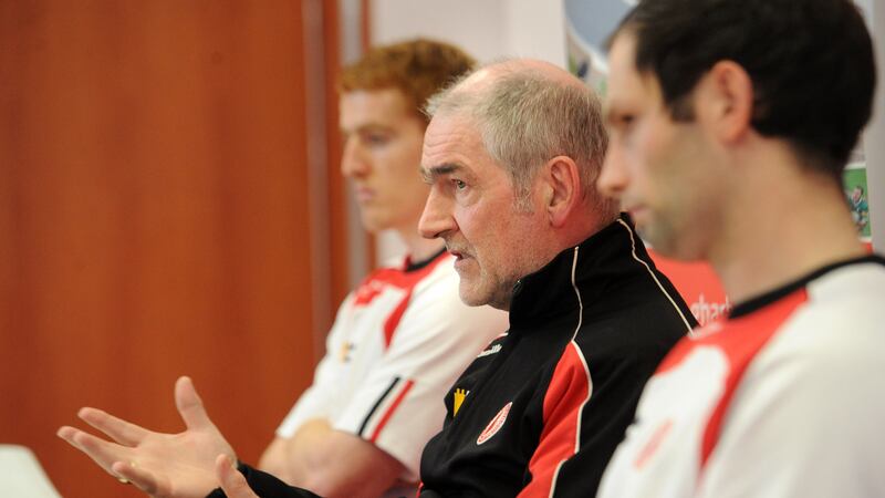 Mickey Harte is pictured at Wednesday night's Garvaghey press conference along with Peter Harte and Ronan McNabb<br />Picture: Declan Roughan&nbsp;