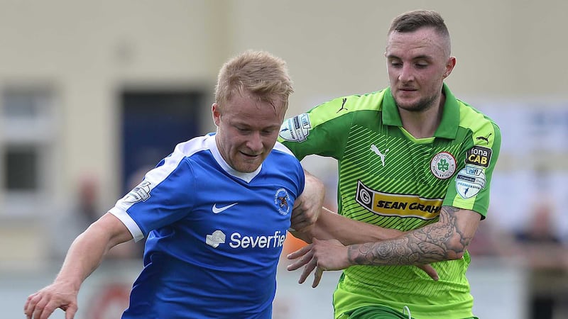 Cliftonville&rsquo;s Jude Winchester and Ballinamallard&rsquo;s John Currie during todays game at Ferney Park. Picture: Pacemaker&nbsp;