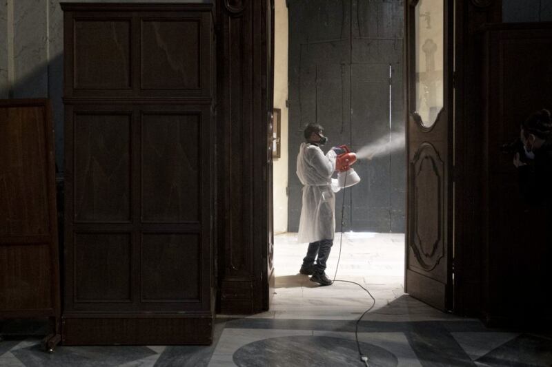A worker sanitises Santa Maria in Trastevere Basilica in Rome to prevent the spread of Covid-19. Lockdown restrictions have eased in Italy this week. Picture by AP Photo/Alessandra Tarantino 