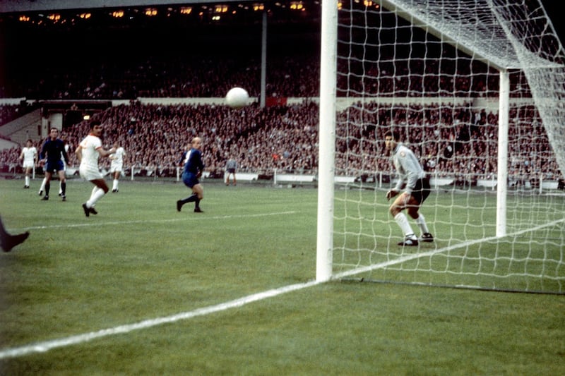 Bobby Charlton glances a header past Benfica goalkeeper Jose Henrique in the 1968 European Cup final