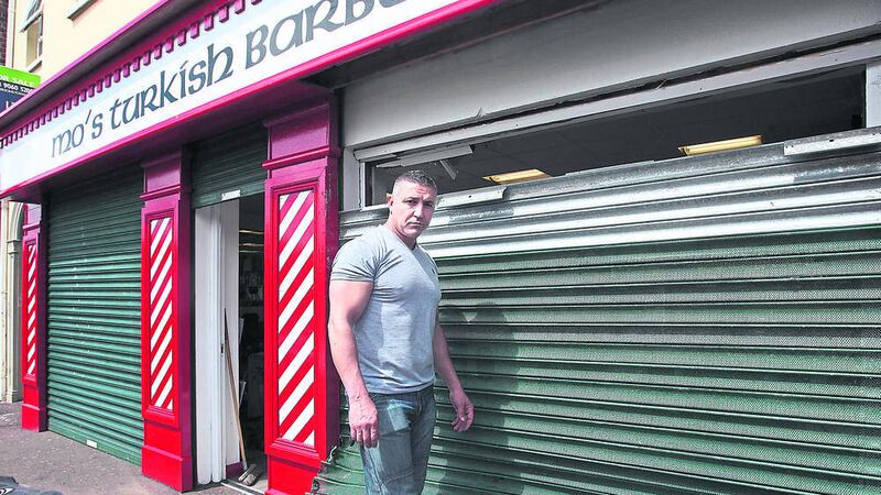 Mehmet &quot;Mo&quot; Oner pictured at his shop  Mo&#39;s Turksih Barbers after a car was rammed through the shutters of the premises. Picture: Ann McManus. 