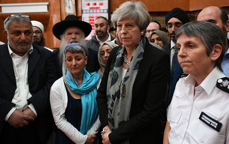 Prime Minister Theresa May and Metropolitan Police Commissioner Cressida Dick talk to faith leaders at Finsbury Park Mosque in north London, near where one man has died, eight people taken to hospital and a person arrested after a rental van struck pedestrians&nbsp;