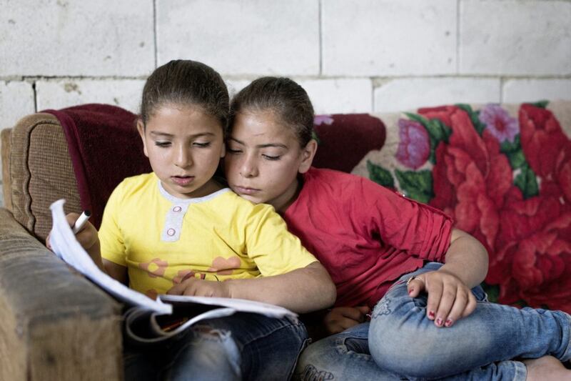 Maya, aged 10, and her sister Reem, aged seven, are Syrian refugees who have fled war and now live with their family in the Beqaa valley in Lebanon. The family are being supported by Tr&oacute;caire. Picture by Simon Walsh 