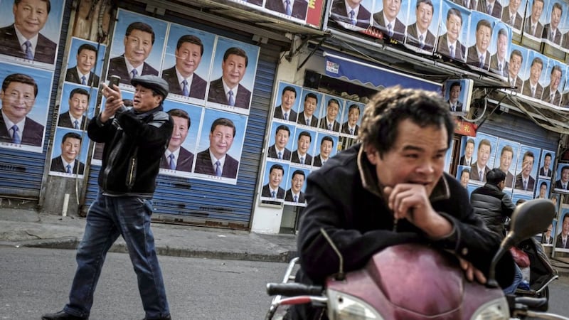 A building covered with portraits of Chinese president Xi Jinping in Shanghai Picture by Chinatopix via AP 
