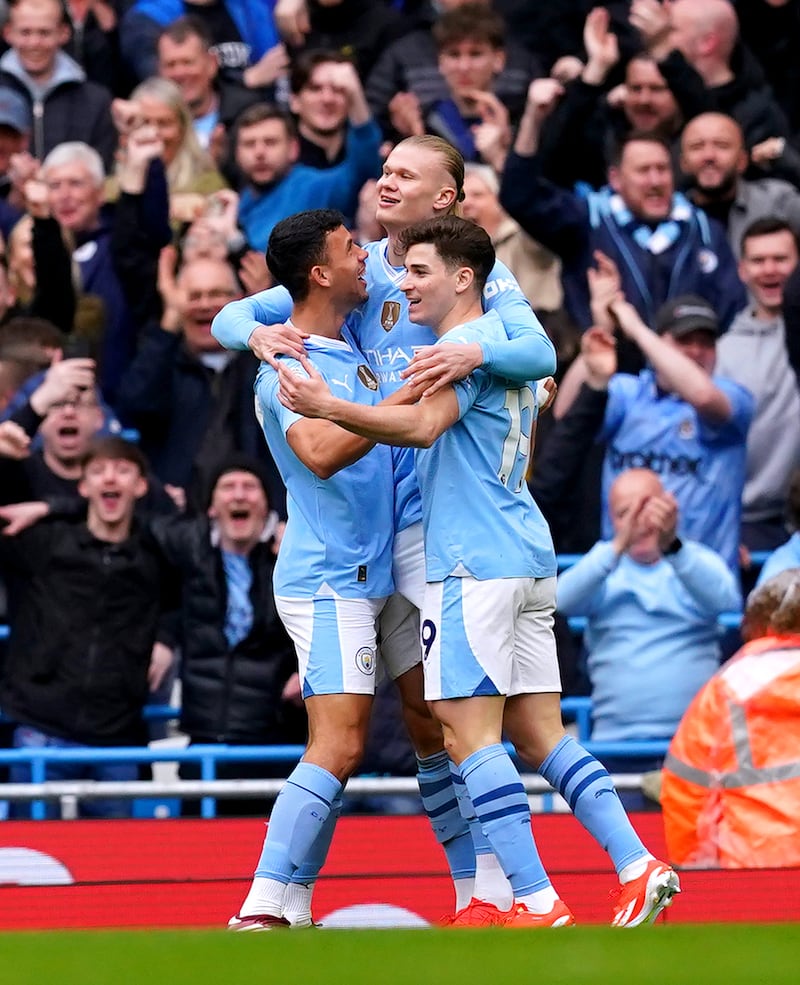 Manchester City’s Erling Haaland (centre), Matheus Nunes (left) and Julian Alvarez celebrate Daiki Hashioka’s early own goal