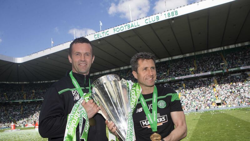 Outgoing Celtic manager Ronny Deila and his assistant John Collins with the SPL trophy at Celtic Park on Sunday<br />Picture by PA&nbsp;