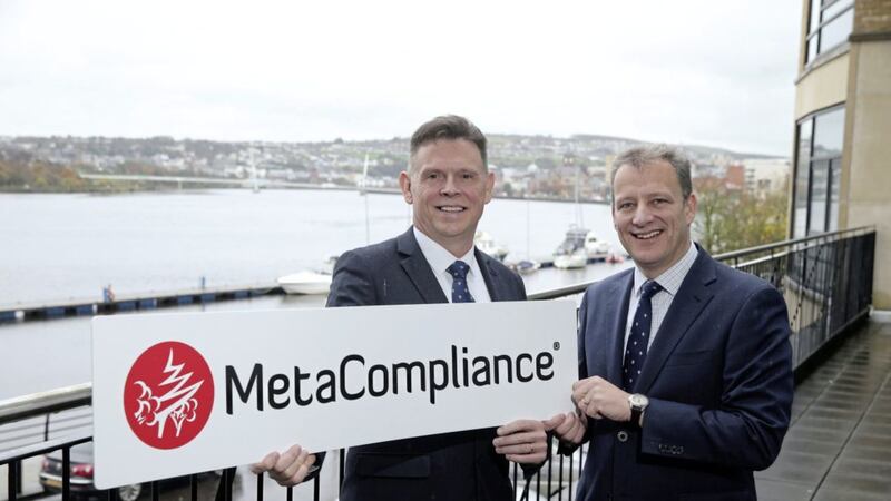Robert O&#39;Brien, CEO of MetaCompliance, pictured with Jeremy Fitch, from Invest NI last year. The company has announced a new recruitment drive and is looking for 30 graduates 